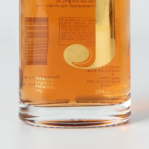 clear glass brandy bottle