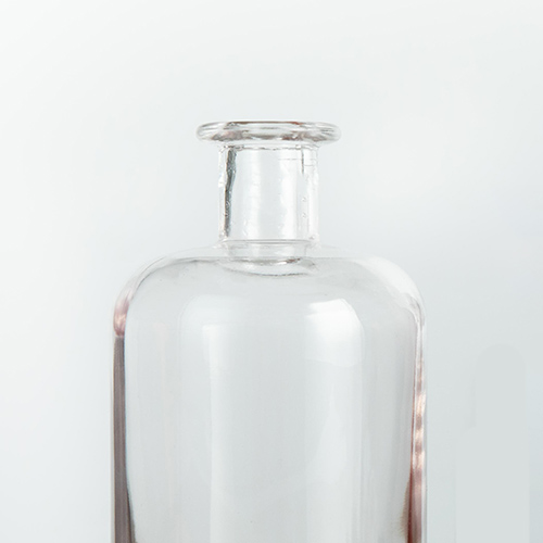 clear glass whisky bottle