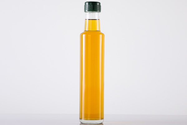 clear tall oil bottle