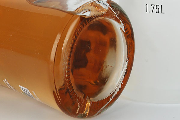 transparent glass liquor bottle